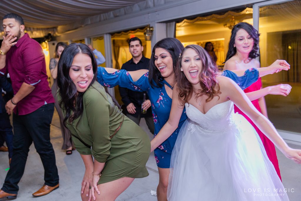 bride and bridesmaids having fun on the dancefloor
