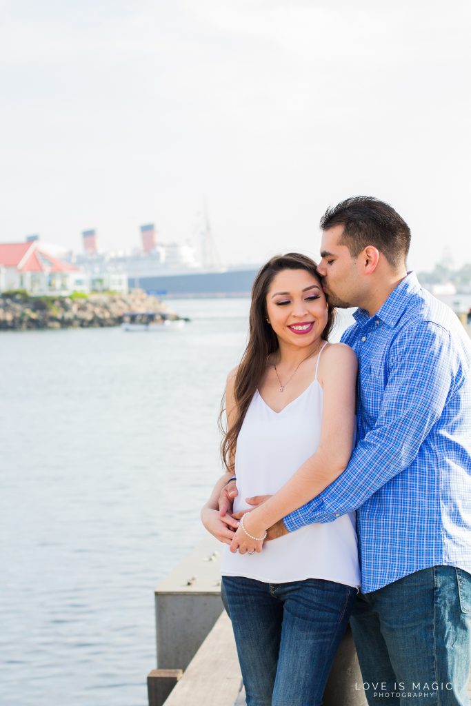 Long Beach engagement couple kisses in front of Queen Mary