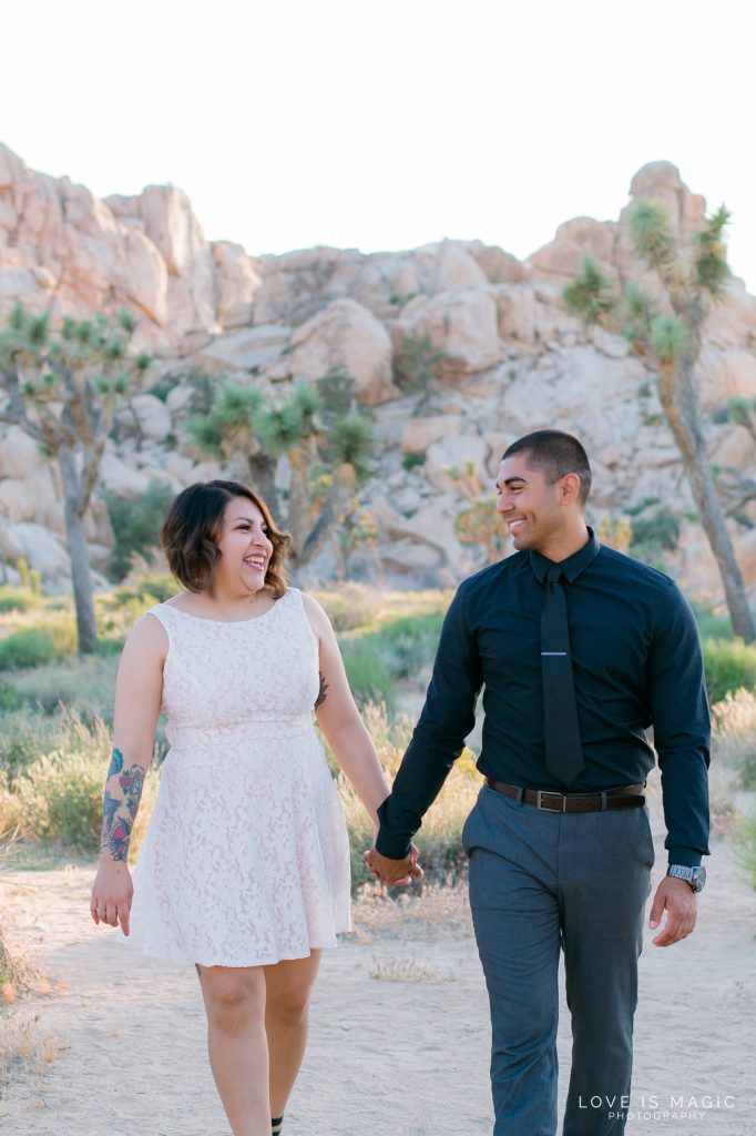 bride and groom walk down Quail Springs for their Elopement, photo by Love is Magic Photography