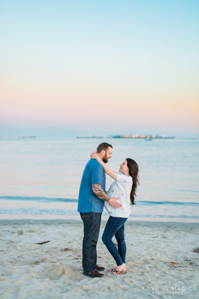 Long Beach engagement couple poses as sunsets