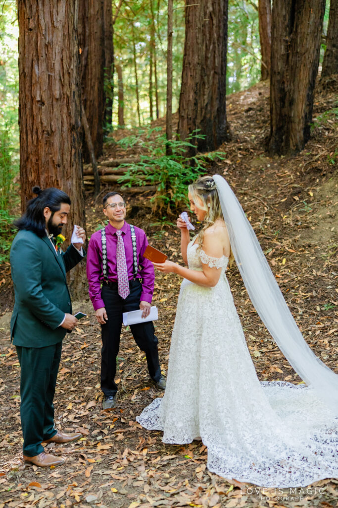 Big Sur Elopement couple tears up at ceremony and dry tears with napkins