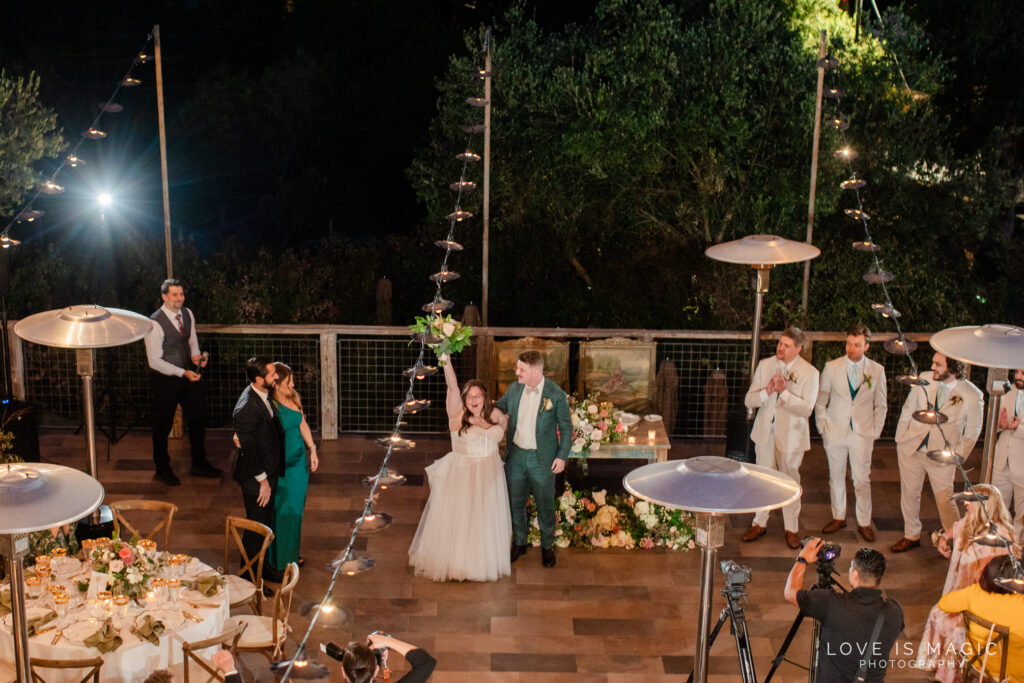 bride and groom enter their reception at The Ranch Laguna Beach, photo by Love is Magic Photography