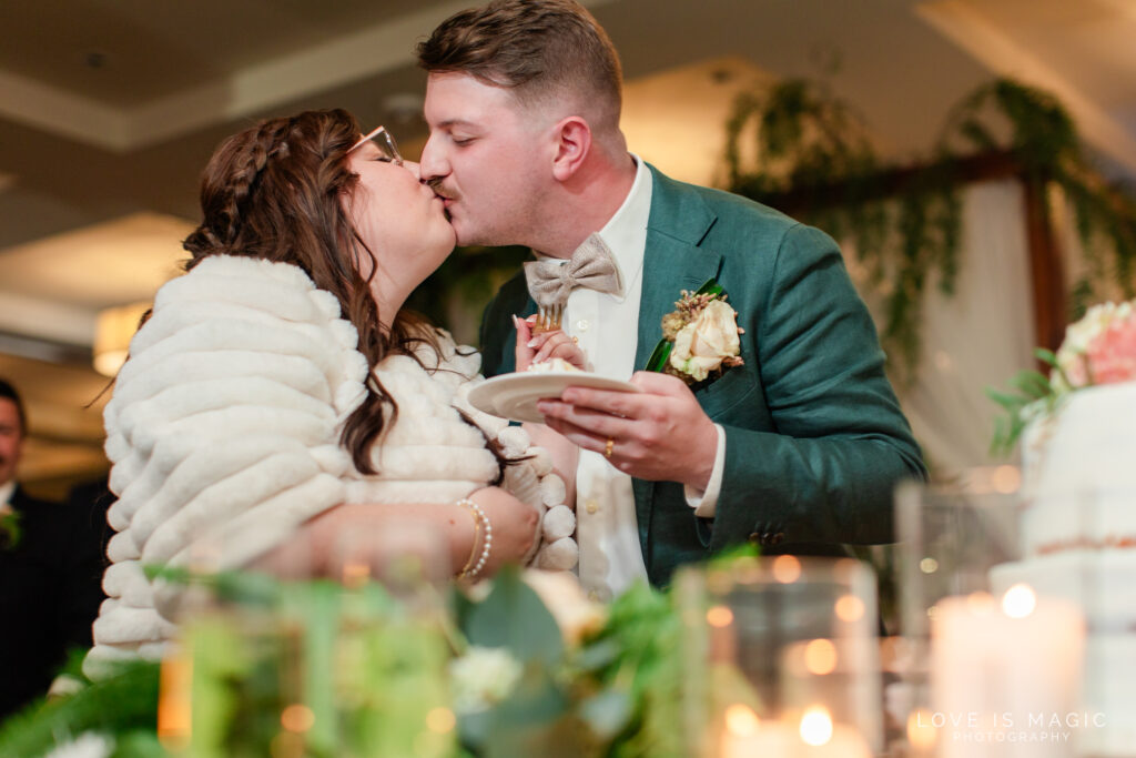 kiss after cake cut, photo by Love is Magic Photography