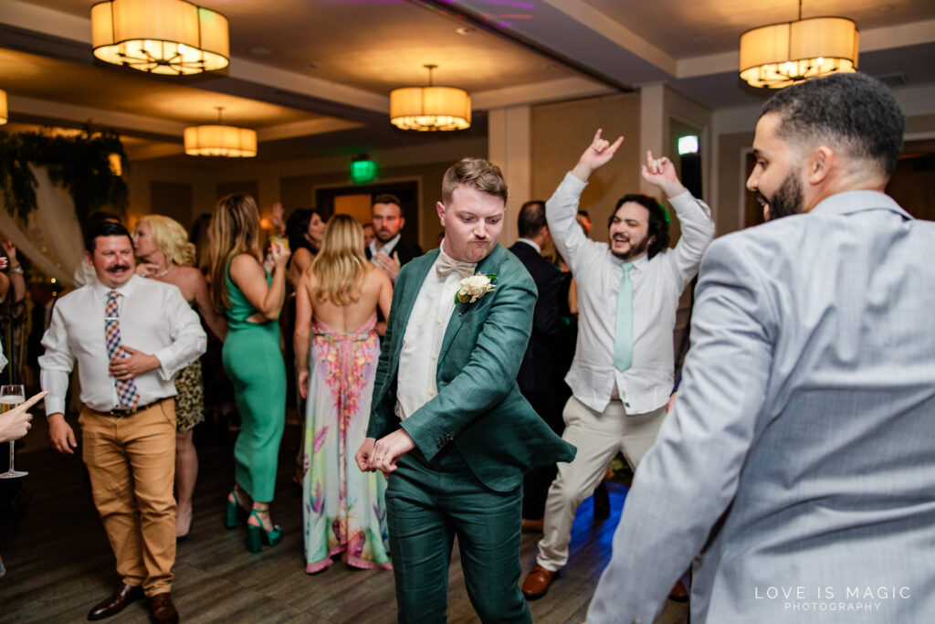 groom and groomsmen dancing, photo by Love is Magic Photography