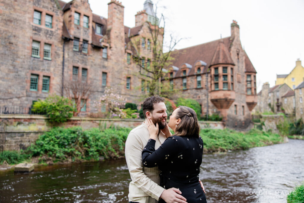 engaged couple kisses in Dean Village