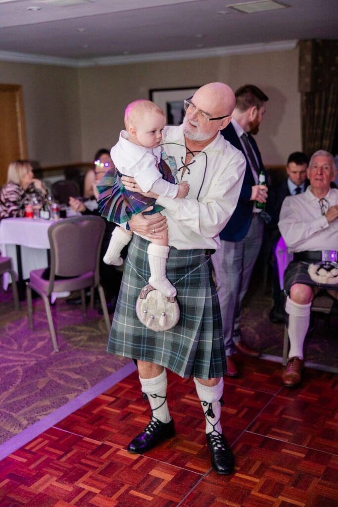 Three generations wearing kilts at a Grange Manor Hotel wedding in Falkirk