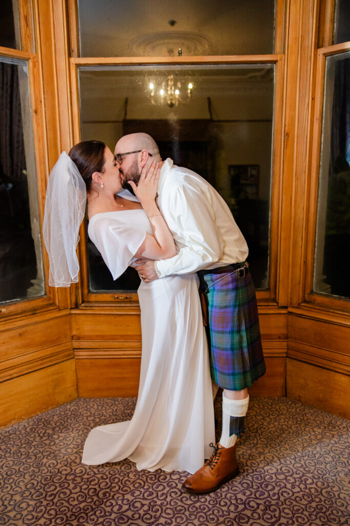 Documentary wedding photography in Falkirk capturing emotional hugs and connection