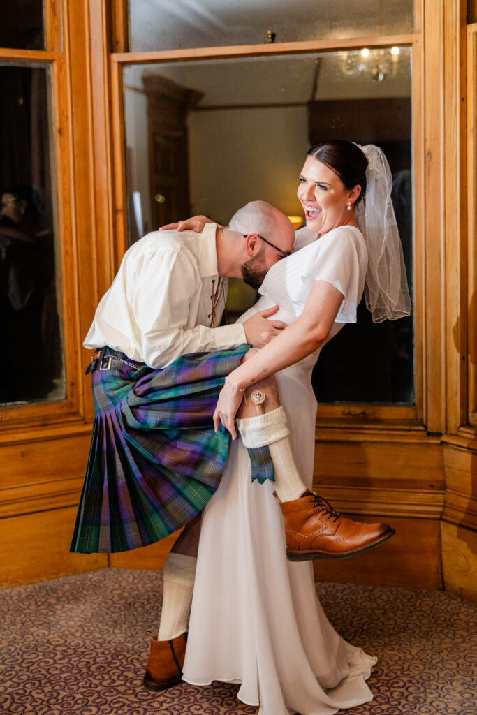 Candid wedding moment photographed by a Falkirk wedding photographer showing real laughter