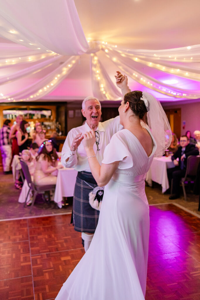 Candid dance floor moments from a joyful Grange Manor Hotel wedding in Falkirk