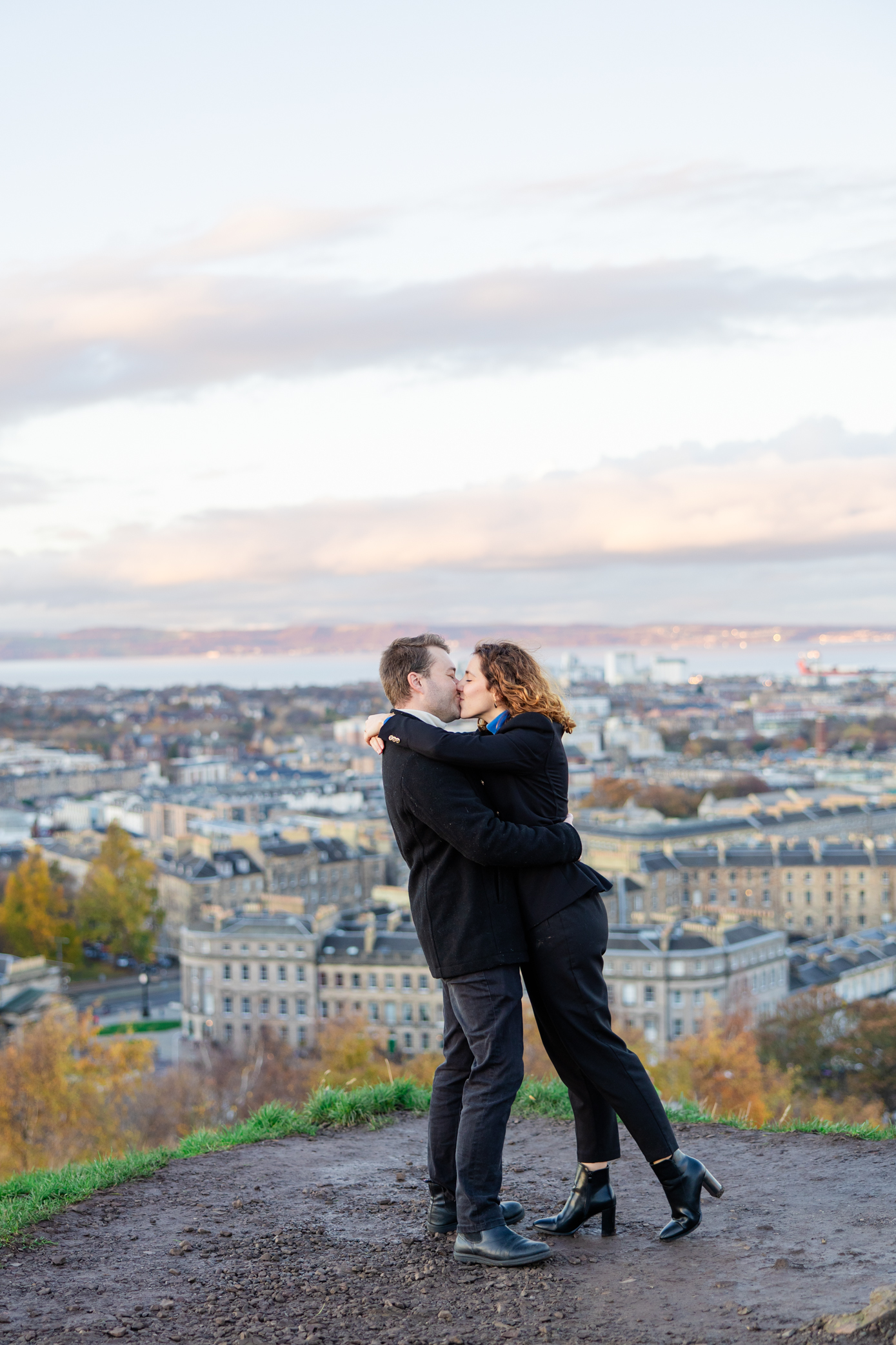 Couple kisses at their Calton Hill Proposal