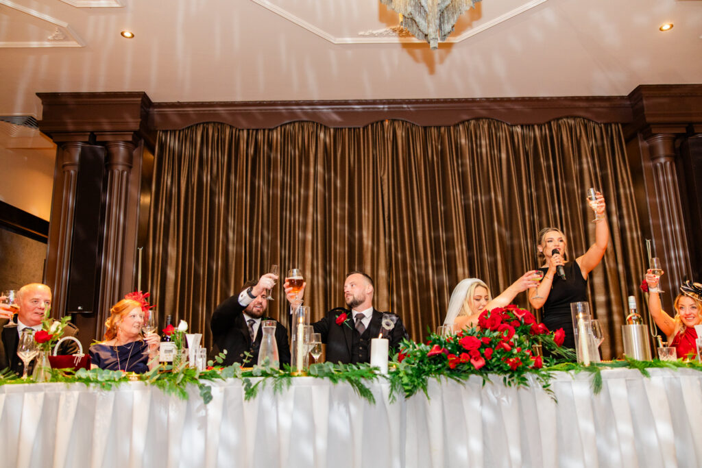 bridal party cheering during wedding speeches