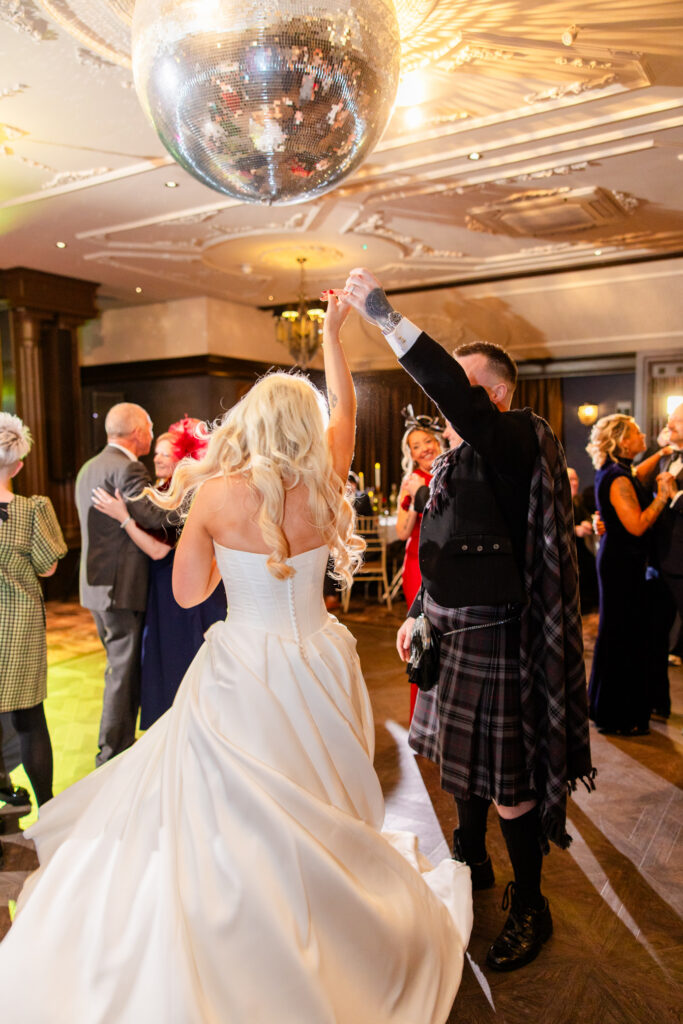 First dance under disco balls at Cornhill Castle wedding