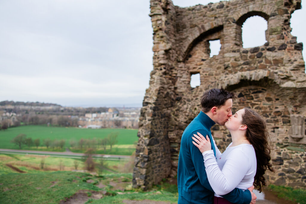 kissing in front of chapel ruins