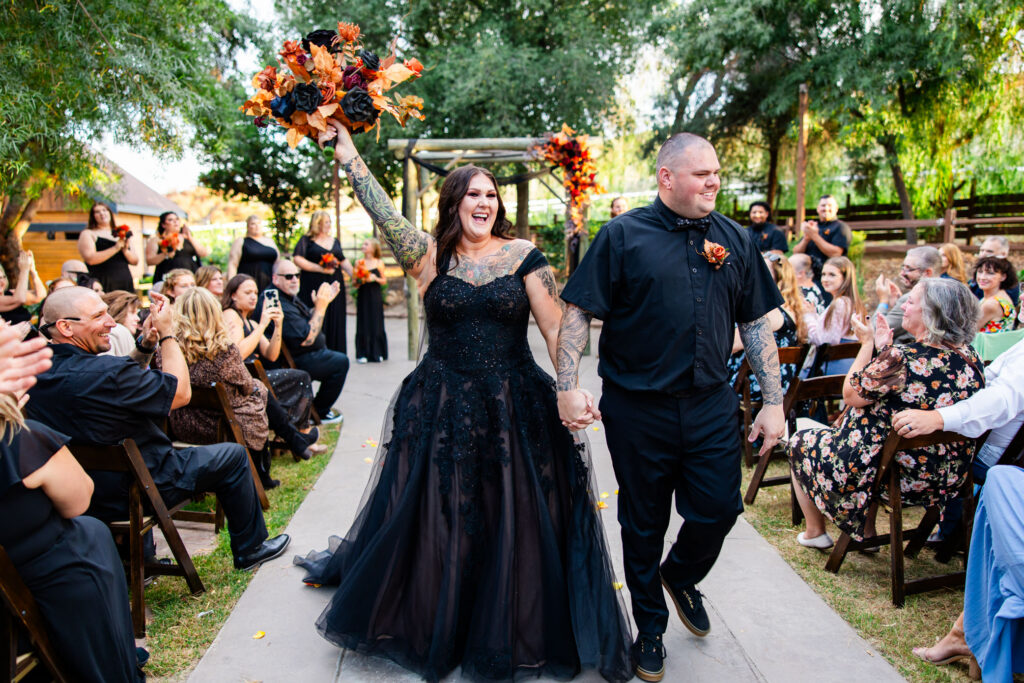 Bride and groom sharing a joyful moment after their ceremony