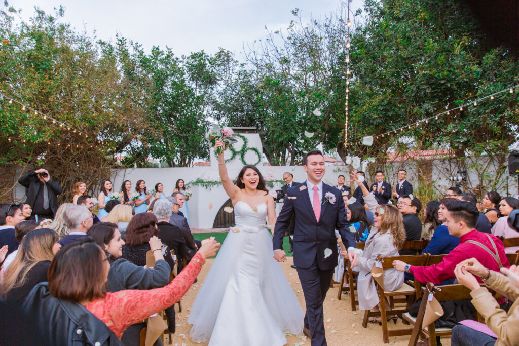 newlyweds cheer walking down the aisle