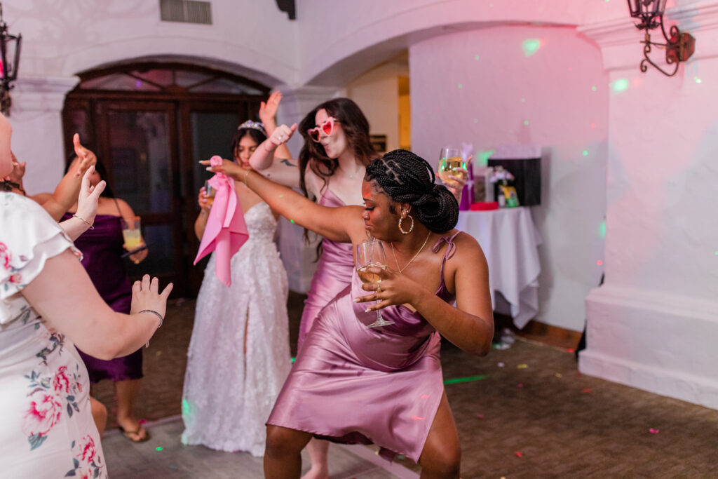 bride dancing with her bridesmaids