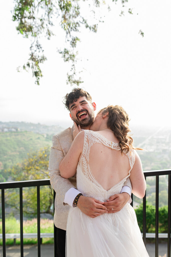 Couple laughing together during relaxed Edinburgh wedding portraits