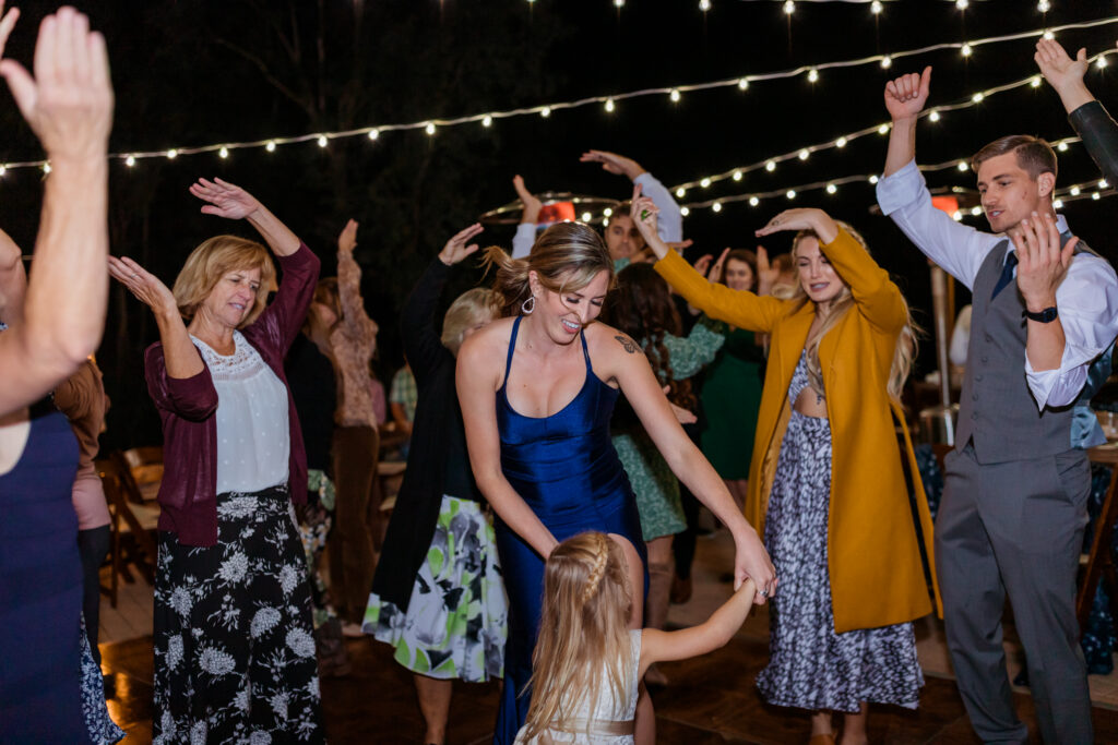Colourful Documentary Wedding Photographer captures guests dancing at the wedding party 