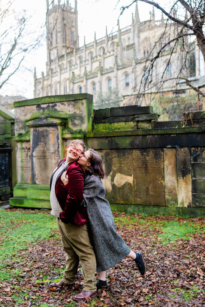 smiling and being goofy in a graveyard