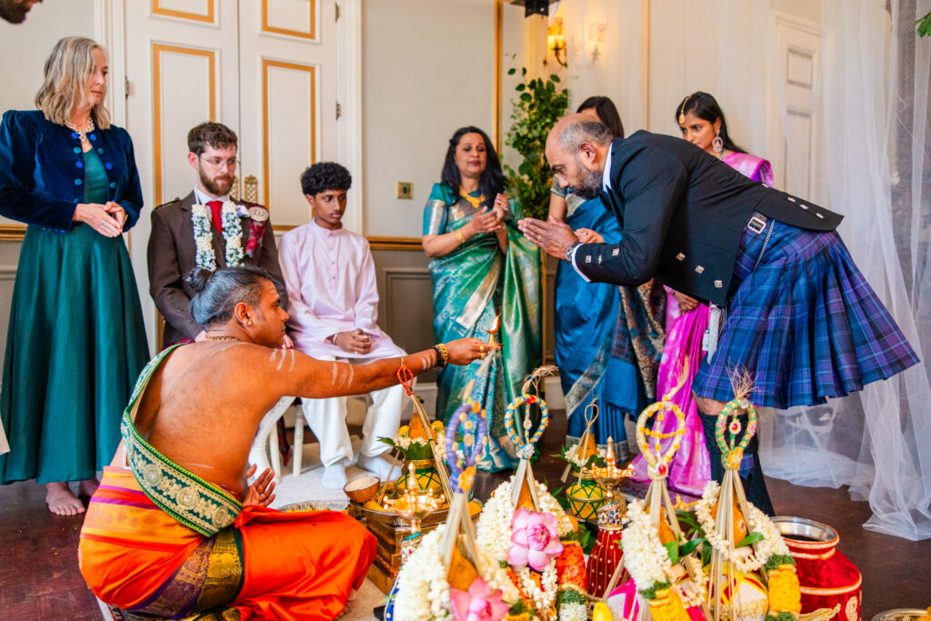 Hindu wedding ceremony beginning at Melville Castle with family gathered around the sacred fire