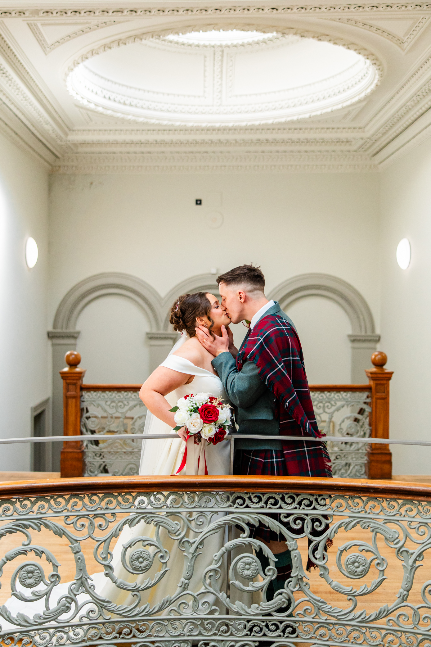 Kilmardinny House couple kissing on stairs 2