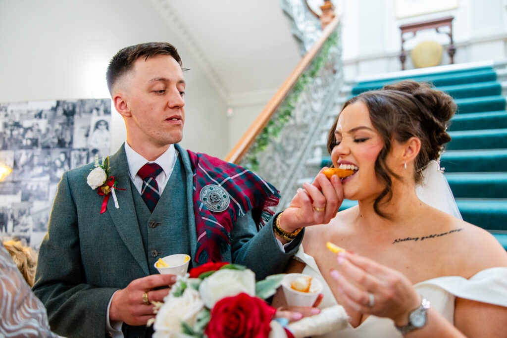 Kilmardinny House groom feeds bride