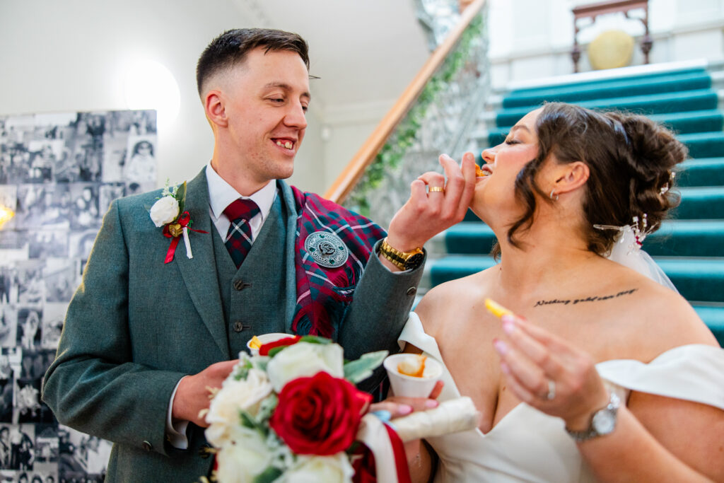 Kilmardinny House groom feeds bride 2