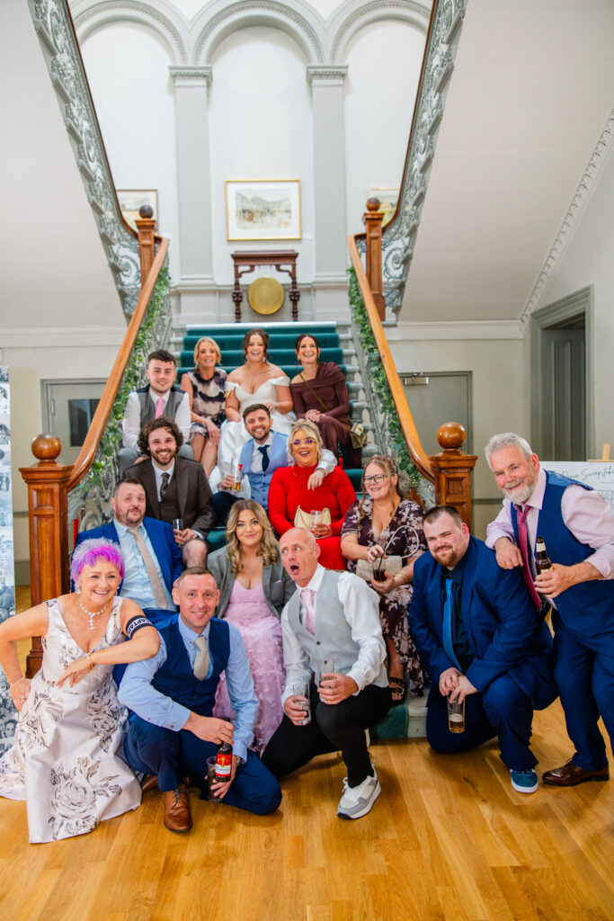 group guest photo on staircase
