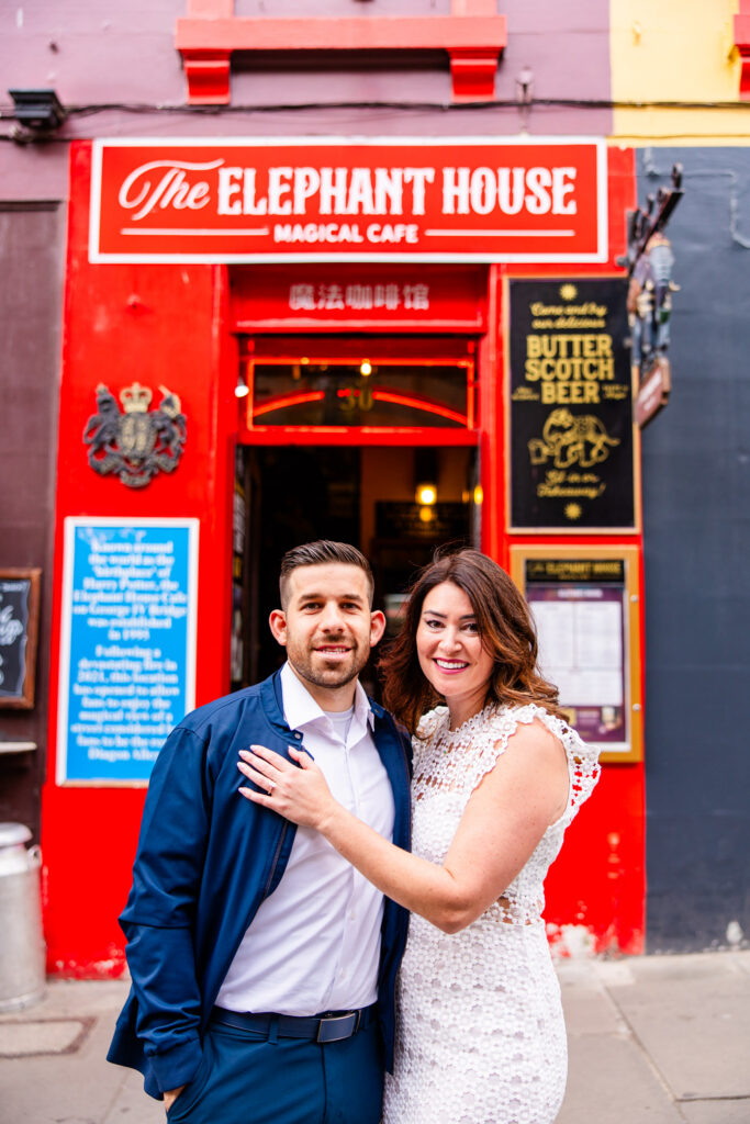 Couple embracing outside the Elephant House in Edinburgh's Old Town