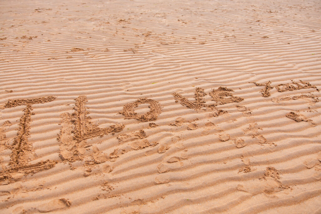 Marriage proposal message written in the sand on Elie beach